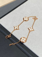 GlowSTAR AND SUN 5 MOTIF MOP PINK GOLD BRACELET