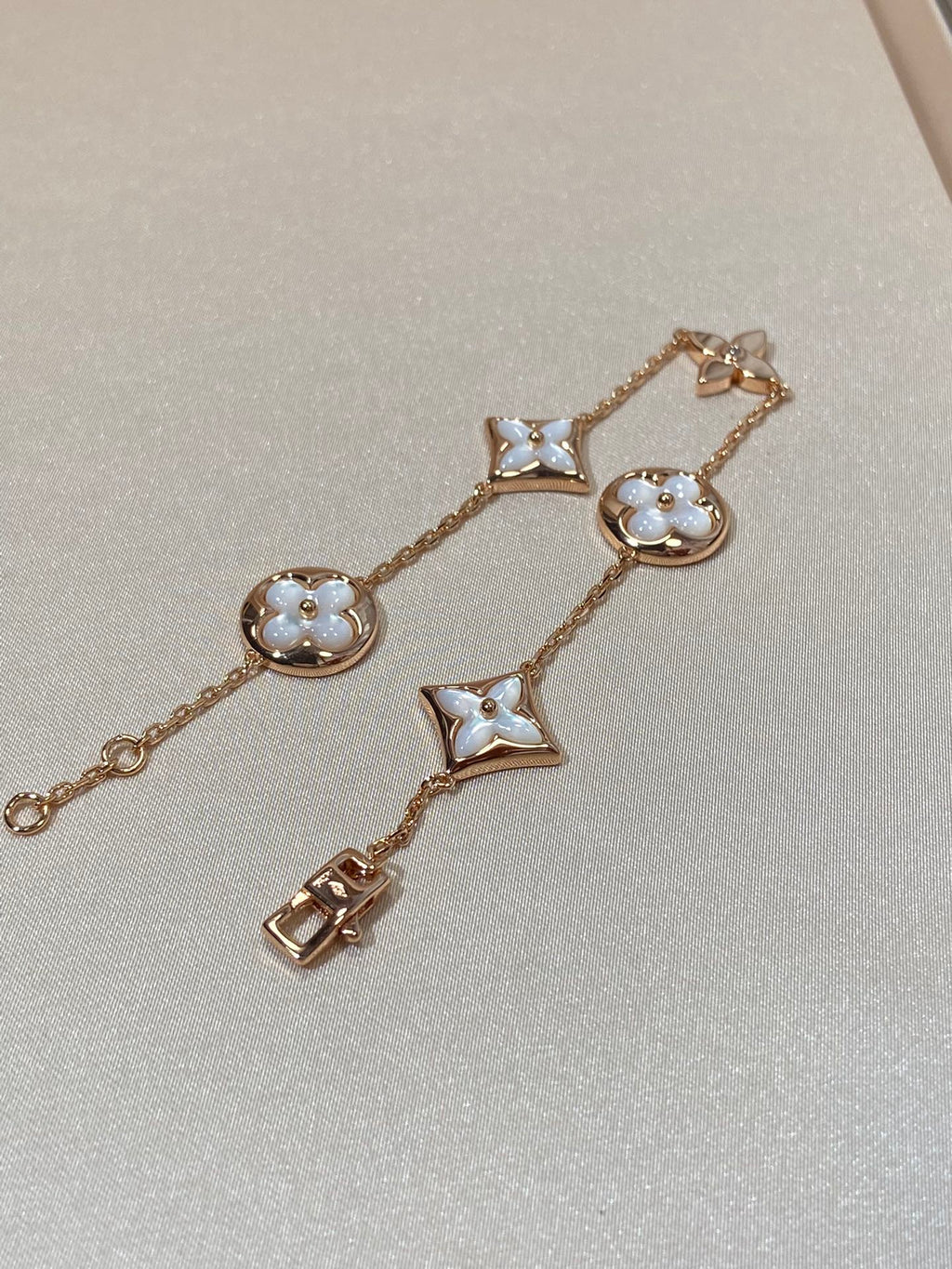 GlowSTAR AND SUN 5 MOTIF MOP PINK GOLD BRACELET