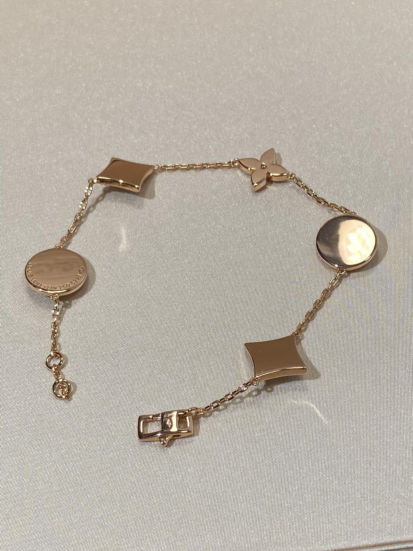 GlowSTAR AND SUN 5 MOTIF MOP PINK GOLD BRACELET