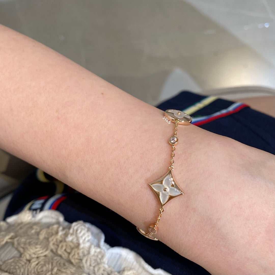 GlowSTAR AND SUN 4 MOTIF WHITE MOP PINK GOLD BRACELET