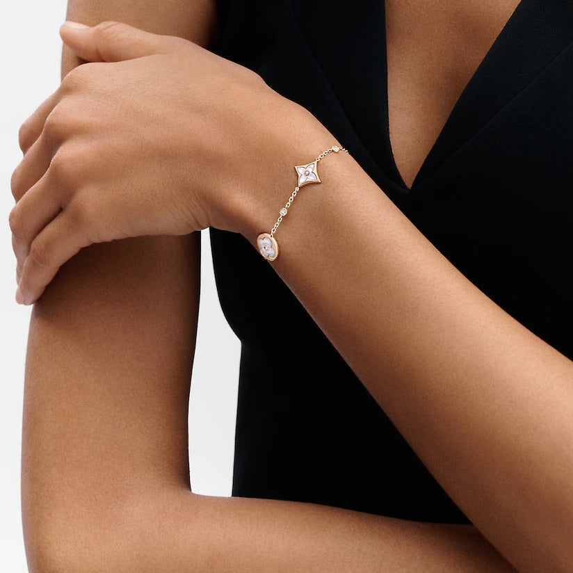 GlowSTAR AND SUN 4 MOTIF WHITE MOP PINK GOLD BRACELET