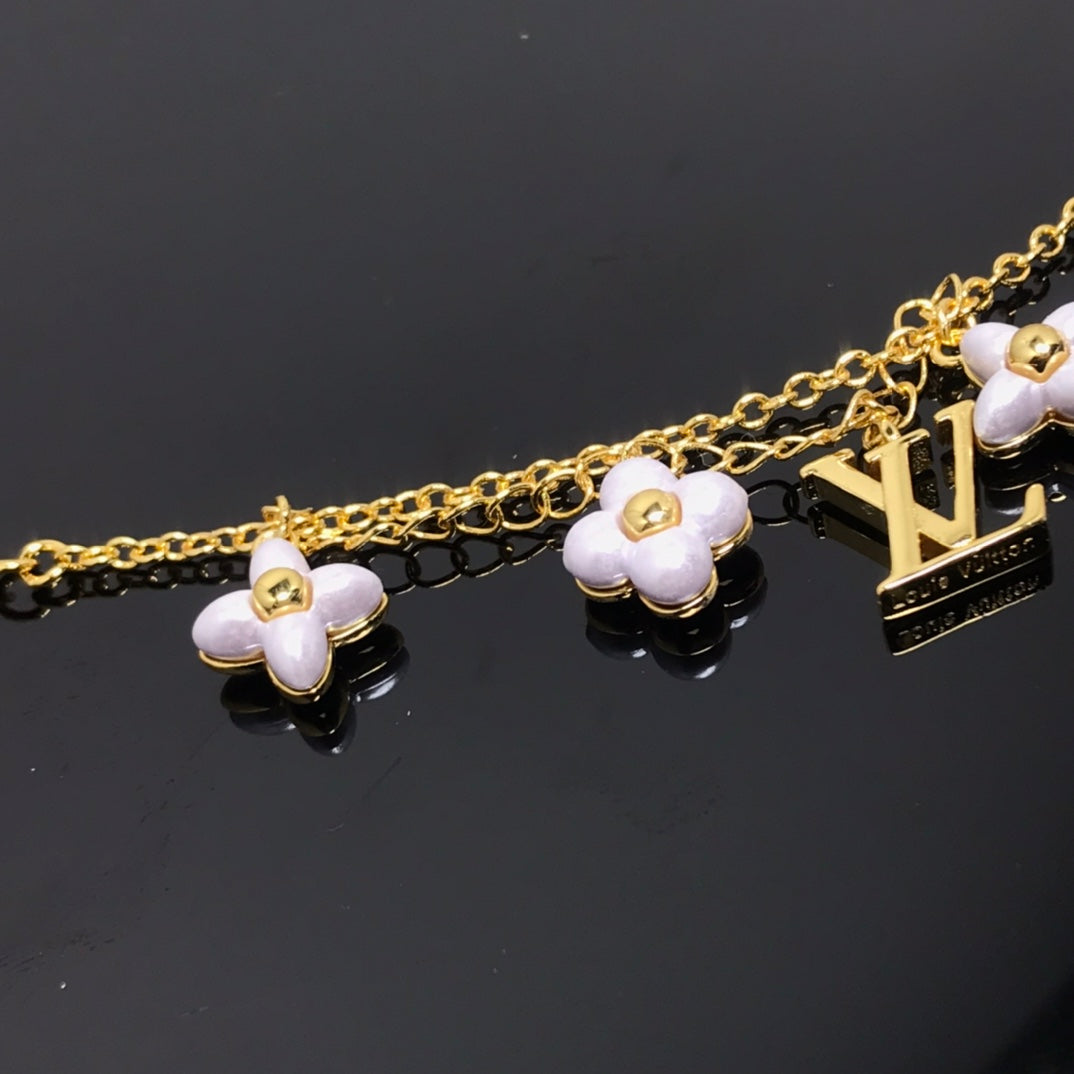 GlowLOGO 6 MOTIF STAR AND SUN GOLD BRACELET